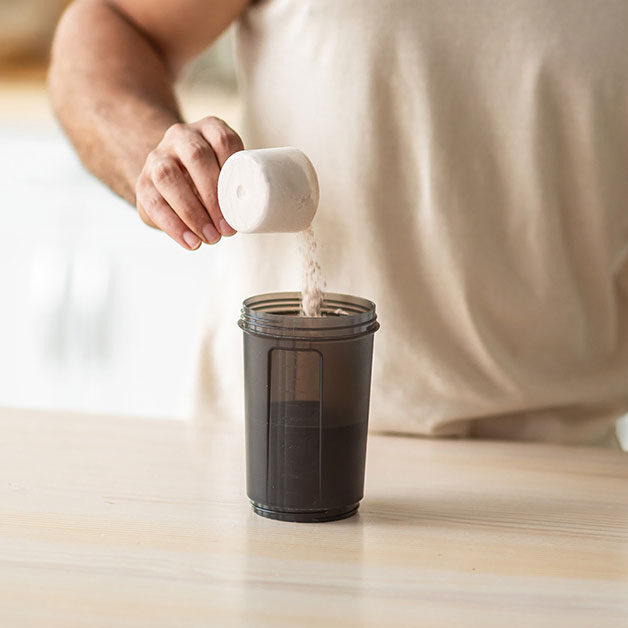 hand-scooping-protein-powder