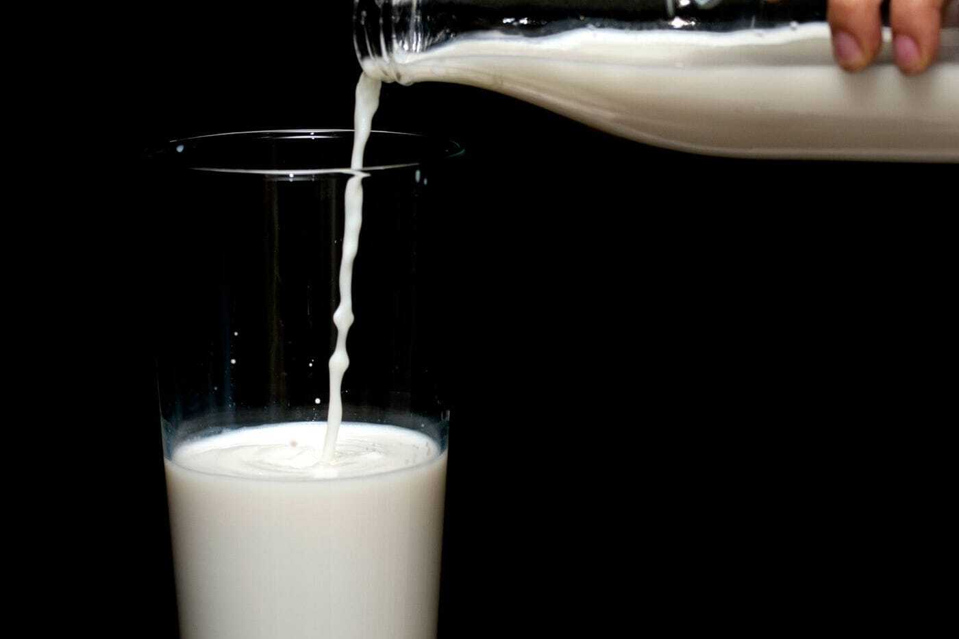 Soy milk being poured into a glass