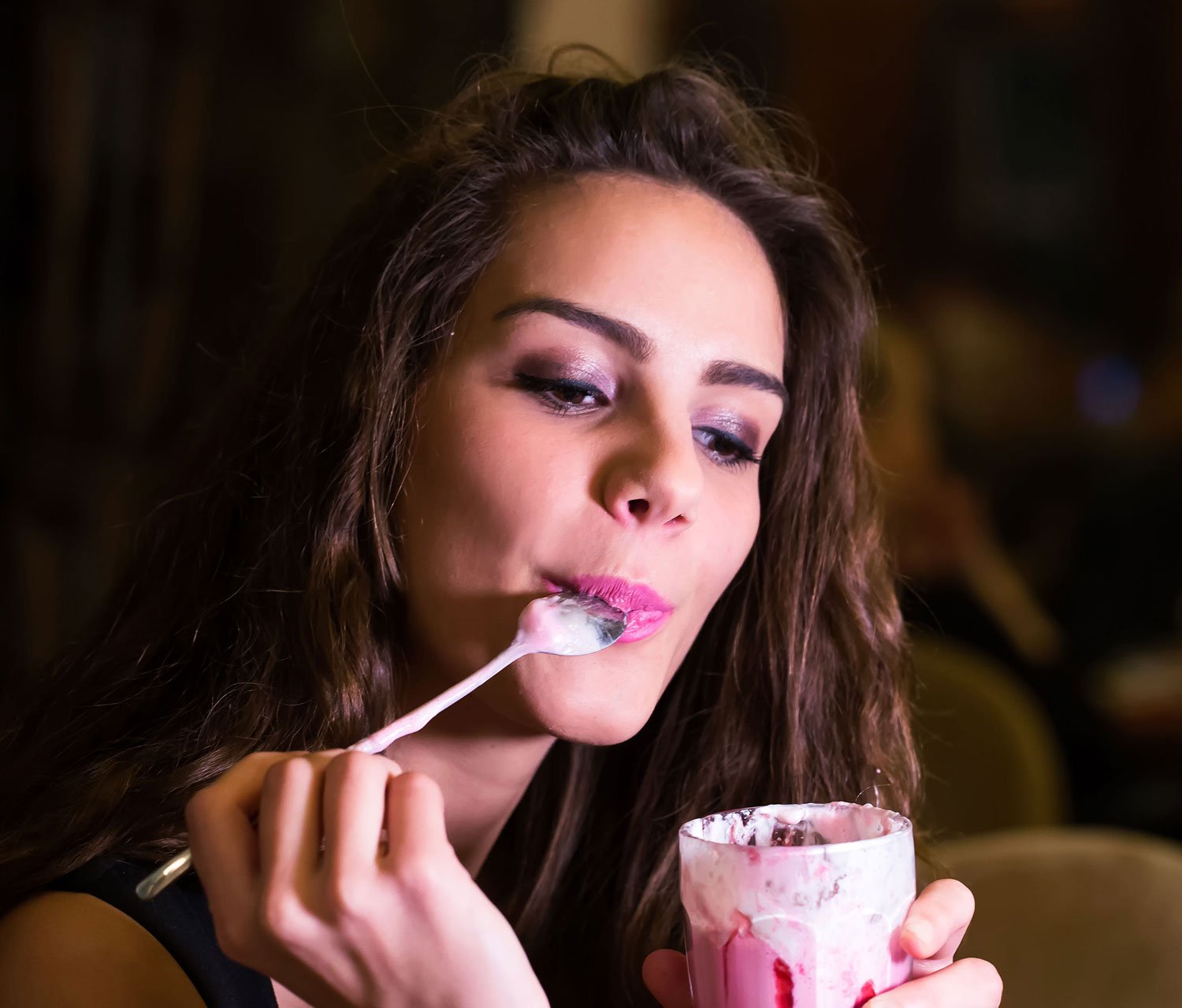 woman-eating-yogurt-nightlife